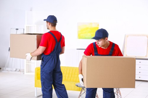 Specialist movers handling an upright piano removal in Harrow
