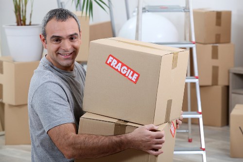 Man and van team preparing equipment safely before a move