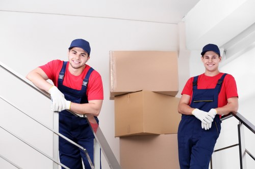 Man and Van Harrow loading recyclable household items into a van