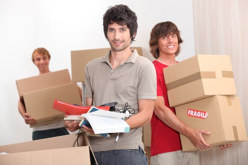 Local moving truck helping with furniture and boxes in Harrow