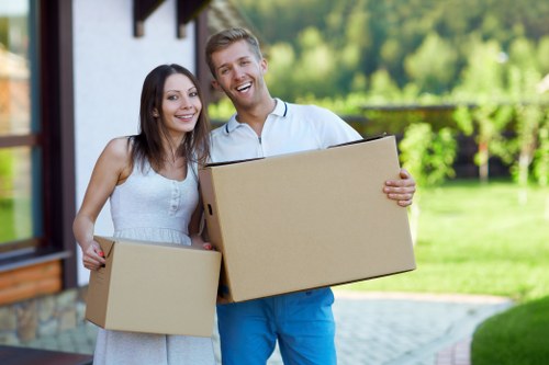 Moving boxes and household items from a Harrow flat with stairs and lift access