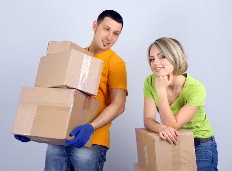 Residential removals in Harrow showing careful handling of furniture and boxes