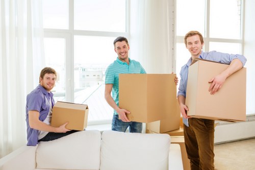 Loading furniture into a van for transport in Harrow