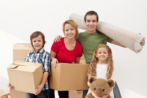 Professional movers handling fragile items during a Harrow house move