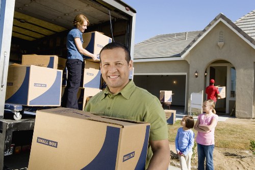 Unpacking service helping a family settle into a new home in Harrow